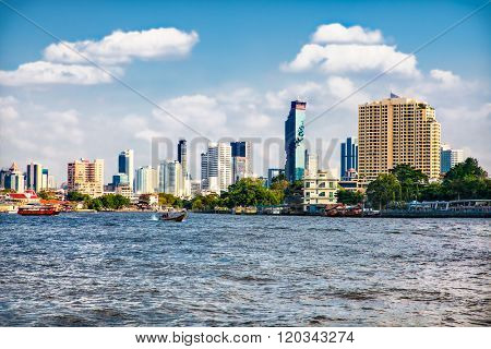 Business district cityscape from Jaopraya river in Bangkok, Tailand.