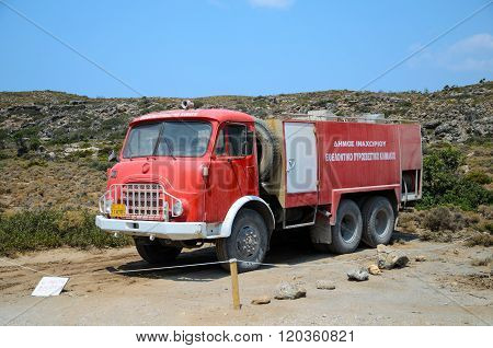 Old  red fire truck at Elafonisi on Crete island