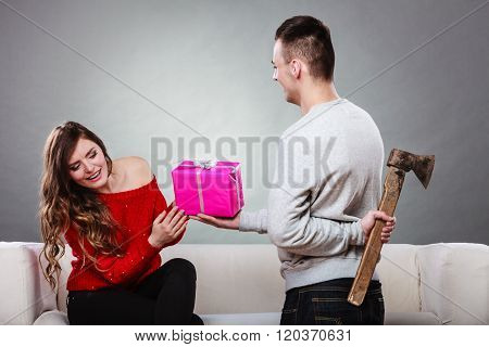 Insincire Man Holding Axe Giving Gift Box To Woman