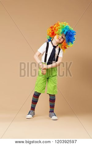 Little Boy In Clown Wig Dancing And Having Fun