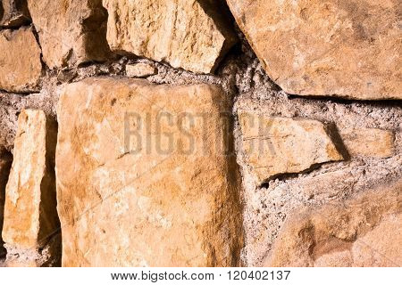 Large Glossy Stone Wall. Diagonal View.