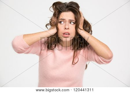 Sad woman standing isolated on a white background