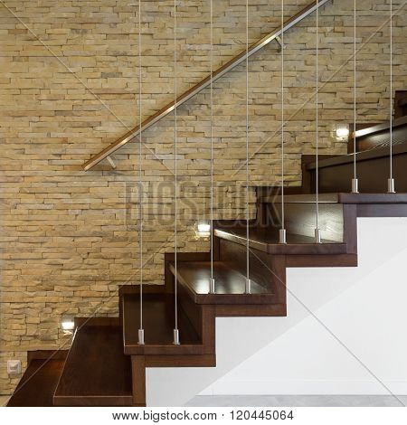 Wooden Stairway And Brick Wall