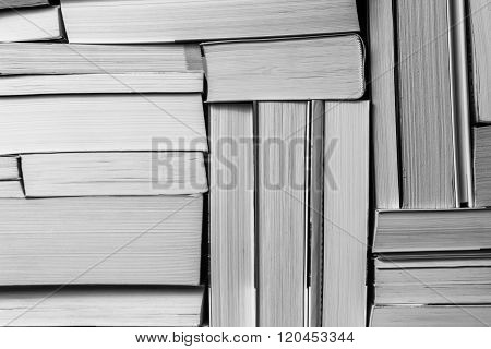 Stack of used old books on bookshelf