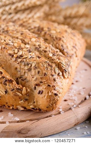 Loaf Of Multicereal Bread On Wooden Board