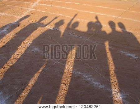 shadow of runner on racetrack