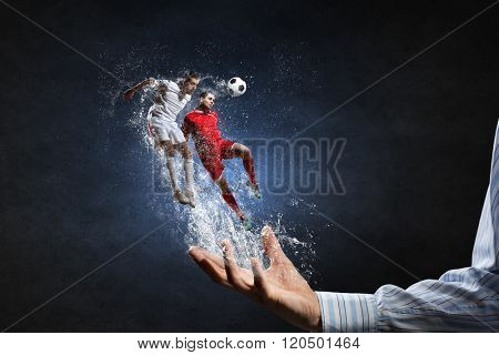 Soccer players fighting for ball