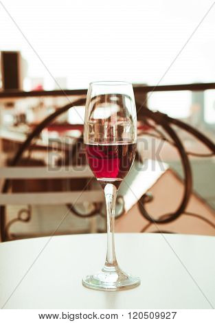 glass of wine clodeup on the balcony