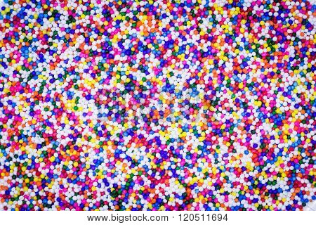 Sugar sprinkle dots decoration for cake and bekery a lot of sprinkles as a background