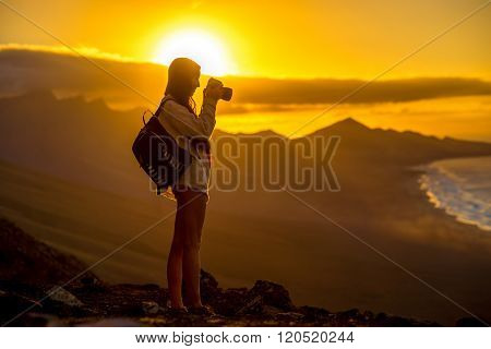Woman photographing Fuerteventura island