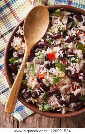 Rice With Red Beans In A Bowl Close-up On The Table. Vertical Top View
