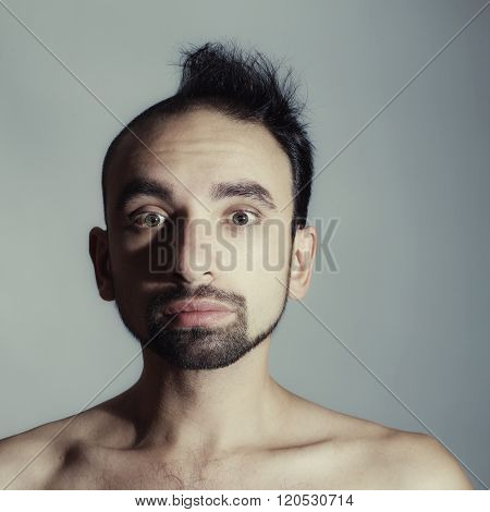 Syudio portrait of Half shaved male closeup