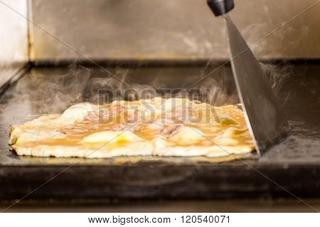 Closeup Of Tasty  Fried Scrambled Egg On Grilling Panel