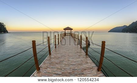 Kerachut Beach jetty at sunset. Nature composition