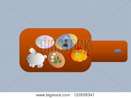 five easter eggs lying on a cutting board for the celebration of Easter