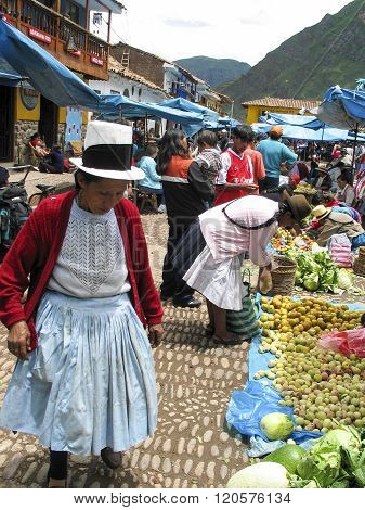 PISAC, PERU - MARCH 2, 2006: Unidentified people at the market in Pisac. It is a Peruvian village in the Sacred Valley. The village is well known for its market every Sunday Tuesday and Thursday.