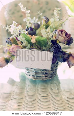 White Paper Blank On Flowers Vase Decorated In Living Room