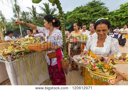SANUR, BALI - MAR 18, 2016: Unidentified local people during ceremony Melasti Ritual. Melasti is a Hindu Balinese purification ceremony and one of the most important rituals of Bali island. 