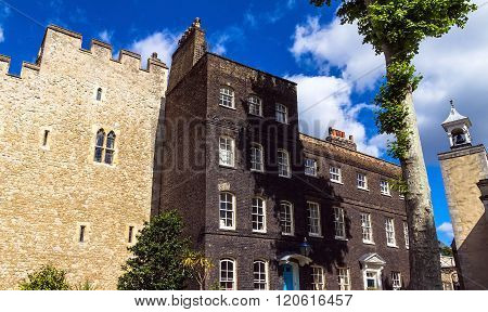 LONDON UK - JUNE 6 2015 : Historic buildings at Tower of London historic castle on the north bank of the River Thames in central London - a popular tourist attraction