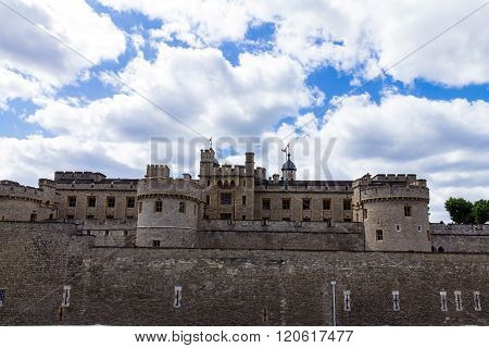 Her Majesty's Royal Palace and Fortress Tower of London historic castle on the north bank of the River Thames in central London - a popular tourist attraction.