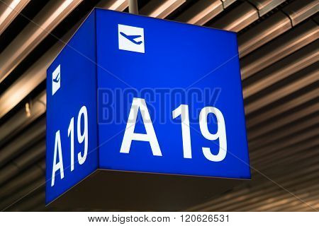 Flight gate sign in an international airport
