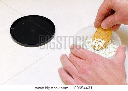 Scooping Blue Cheese Onto A Chip