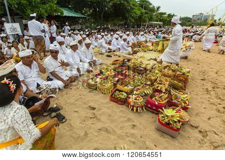 SANUR, BALI - MAR 18, 2016: Unidentified local people during ceremony Melasti Ritual. Melasti is a Hindu Balinese purification ceremony and one of the most important rituals of Bali island. 