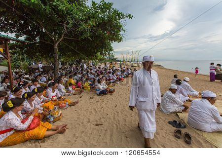 SANUR, BALI - MAR 18, 2016: Unidentified local people during ceremony Melasti Ritual. Melasti is a Hindu Balinese purification ceremony and one of the most important rituals of Bali island. 