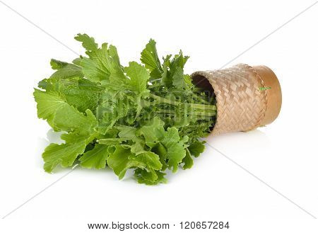 Fresh Turnip Greens In Bamboo Basket On White Background