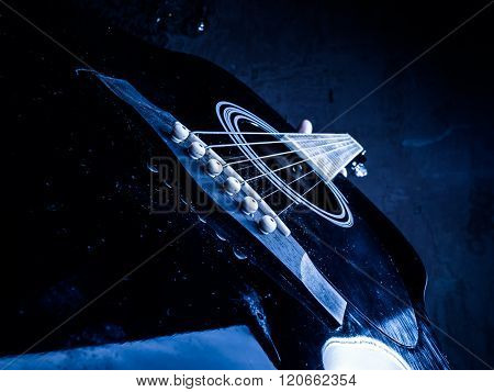 Closeup photo of an acoustic guitar