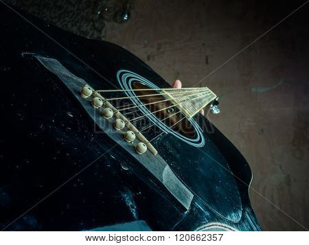 Closeup photo of an acoustic guitar