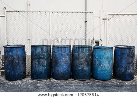 Dirty blue plastic garbage containers