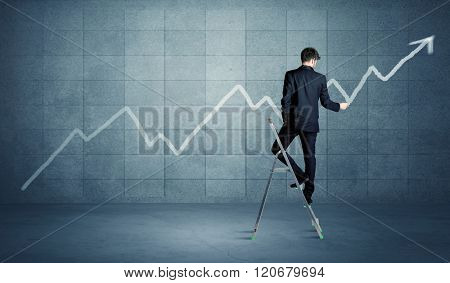 A man standing on a ladder and drawing a chart on blue wall background with exponential progressing curve, line