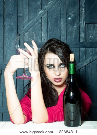 Thoughtful Woman With Bottle