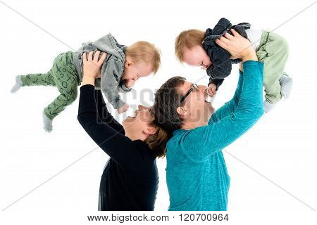 Happy Family With Adopted Twins Is Laughing. Isolated On White.