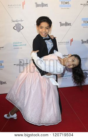 MALIBU - MAR 5: Kevin Tellez, Gaby Palacio at the Children International Charity's 'Share The Love Around The World' Fundraiser at Rocky Oaks Malibu on March 5, 2016 in Malibu, California
