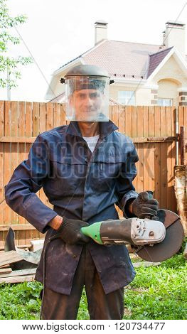 Young Man In A Scullguard On Building