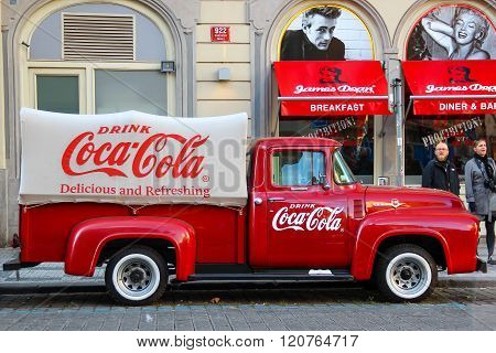 PRAGUE, CZECH REPUBLIC - Oct 23 2015: An old renovated red Ford vintage Coca cola truck (pickup) in