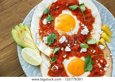 Closeup Of Huevos Rancheros With Sliced Avocado