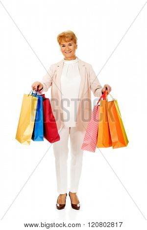 Happy business woman holging shopping bags