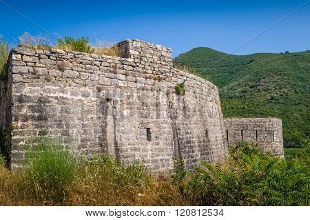 Stone walls of Tvrdava Mogren old fortress in Montenegro