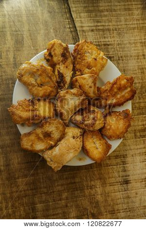 Top View Fried Pieces Of Chicken Lying On White Plate