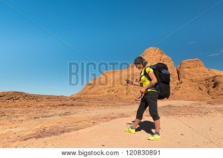 Woman Hiker With Backpack And Gps