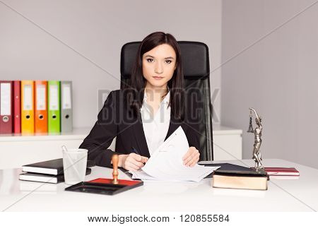 Brunette Woman Notary Public Signing Testament.