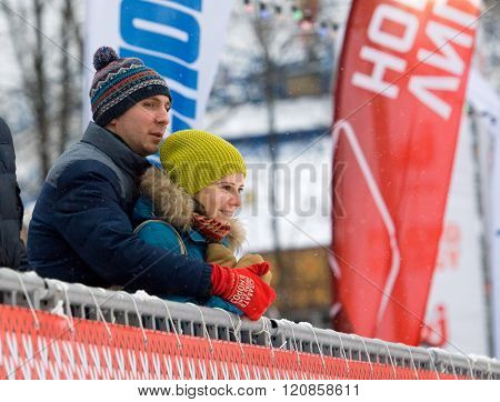 Man And Girl On Tribune
