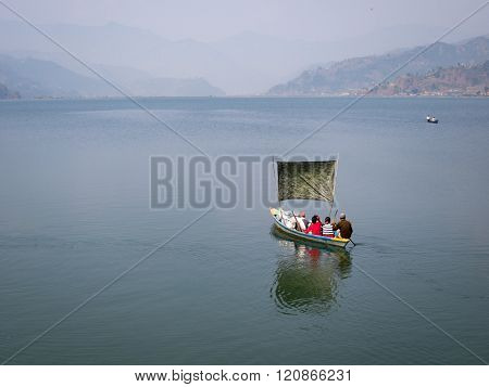 Boaters On A Lake