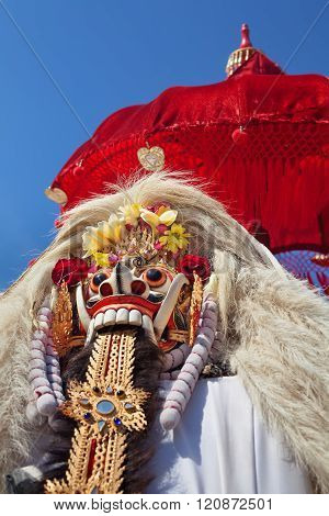 Traditional Balinese Spirit Rangda Under Red Umbrella