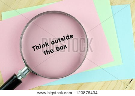 Magnifying glass on papers with inspirational words