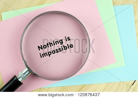 Magnifying glass on papers with inspirational words