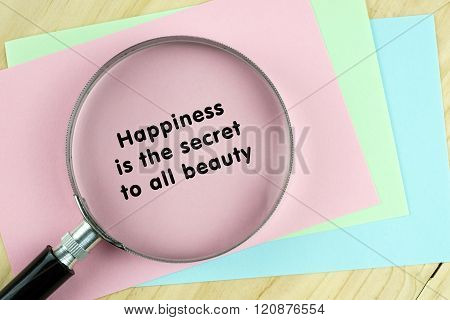 Magnifying glass on papers with inspirational words